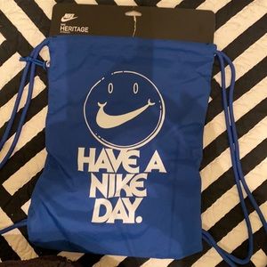 Nike gym sack. Size 12 x 17”. Royal blue with white lettering.
